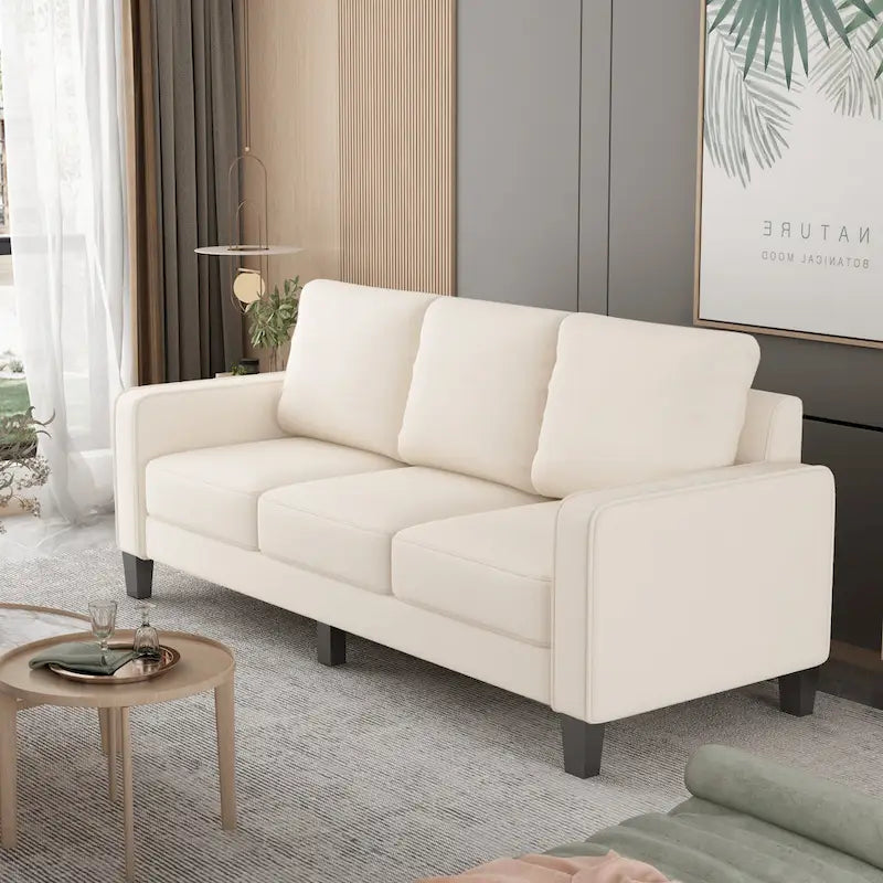 Canapé en tissu beige avec accoudoirs carrés et dossier capitonné